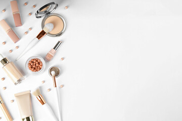Flat lay composition with makeup brushes on white background, space for text