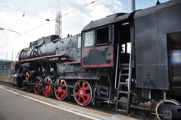 The locomotive of the last century standing under steam