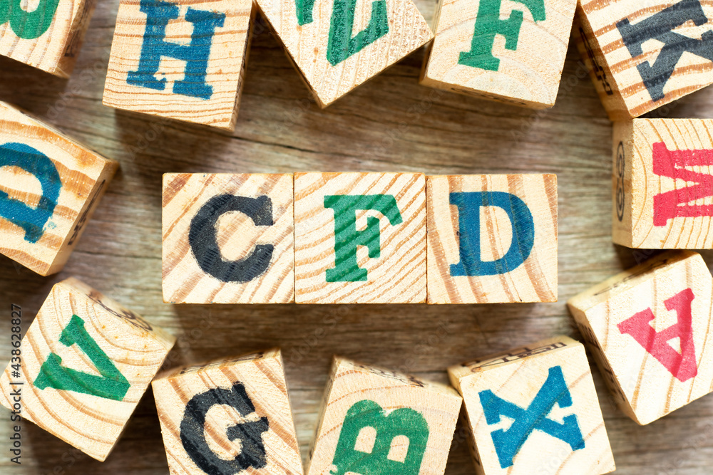 Canvas Prints Alphabet letter block in word CFD (Abbreviation of Contract for Difference) with another on wood background