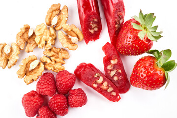 Churchkhela made from strawberry juice and nuts, Georgian traditional sweets isolated on white background with copy space