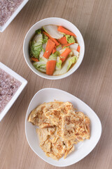 Thai omelet and stir fried chinese cabbage with sweet carrot