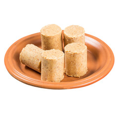 June Celebration. Sweet Brazilian peanut called Paçoca on a plate isolated on white background