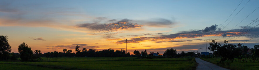 Atmosphere at night sky with sunset light over the village outside.