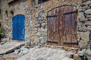 Old doors for boats in a beach of Palafrugell