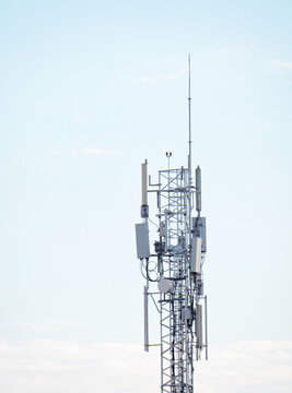 Cell phone tower above clouds