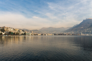 Landscape view of stunning sky and clouds above lake Lugano. Famous tourist destination in South Europe, Lugano, Switzerland