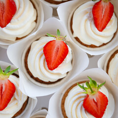 Cupcakes with strawberries close-up. Top view.