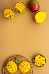 Mango slices and cubes with fresh mango smoothie. Top view