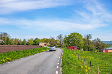 Car driving on a road in the countryside