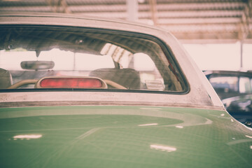 Warning rear lights of pastel green vintage classic car. Transportation and retro car collection...