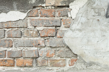Textured red brick wall from old stones