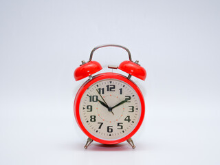 A red clock isolated on a white background.