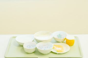 Food tray on the table in a room of a hospital. Patient and hospital concept. Copy space. 