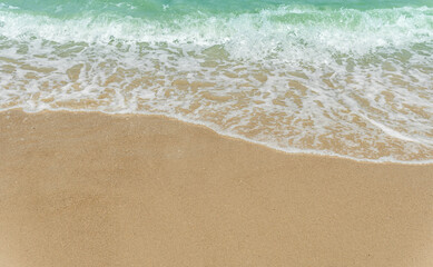 Fototapeta na wymiar waves on the sand beach summer season