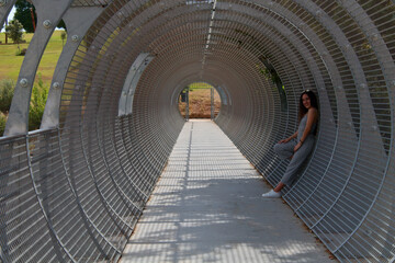 long hair girl in iron tunnel