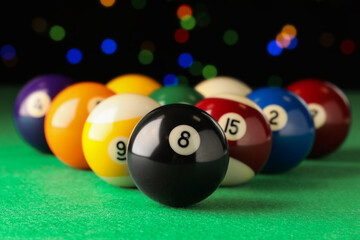 Many colorful billiard balls on green table, closeup - obrazy, fototapety, plakaty