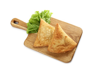 Fresh delicious crispy samosas and lettuce on white background, above view