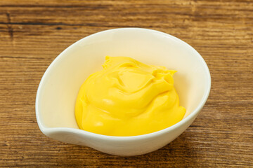 Natural cheese sauce in the bowl