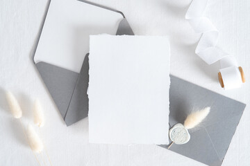 Elegant wedding stationery set. Wedding invitation card templates, grey envelopes, silk ribbon,...