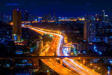 Bangkok cityscape night light. 
Lighting the night highway and tower building