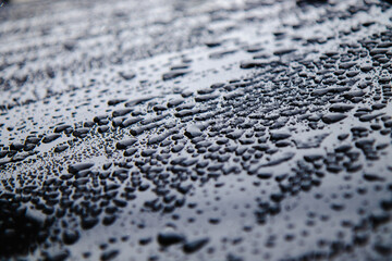 water drops on a gray metal surface.Water drops on metal background.
