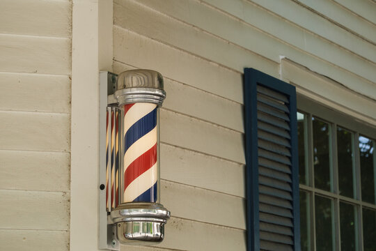 Vintage Red, White and Blue Barber Pole on Side of Barber Shop