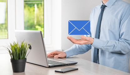 Businessman hand holding e-mail icon, Contact us by newsletter email and protect your personal...