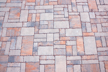 stone flooring with concrete blocks in grey and brown colors
