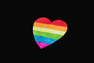 handmade heart, painted in the colors of the lgbtq+ flag on the dark background. The concept of the...