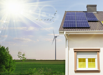 House with installed solar panels on roof. Copy space for text