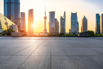 Sunset empty square road and city skyline in Shanghai