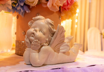 one statuette of gypsum angel