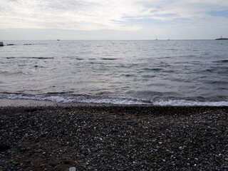 sky, horizon, stones on the seashore, pebbles,