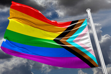 the New Pride Flags Flag of New LGBT rise waving to the wind with sky in the background