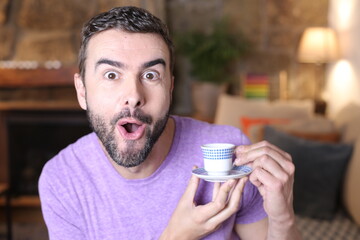 Funny man gossiping during tea time