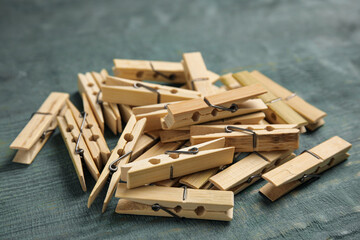 Pile of clothes pins on blue wooden table