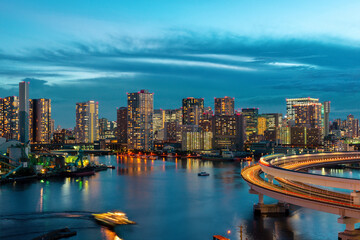 Fototapeta premium Beautiful landscape of architecture of famous modern district Tokyo with bridge, road and sea, Japan travel background