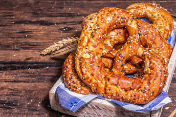 Oktoberfest concept - pretzels on a traditional napkin in a wooden crate
