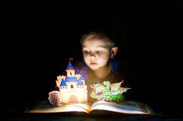 The child sees fairy tales and magic in the book