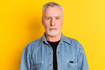 Photo of confident old man wear jeans blazer isolated on vibrant yellow color background