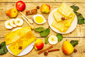 Autumn composition with fresh apples, pears, honeycombs and fragrant spices