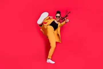 Foto op Aluminium Full body photo of cool lady dance wear eyewear yellow suit isolated on vivid red color background © deagreez