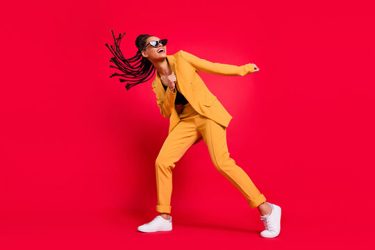 Full Length Photo Of Funny Lady Dance Wear Eyewear Yellow Suit Isolated On Vivid Red Color Background