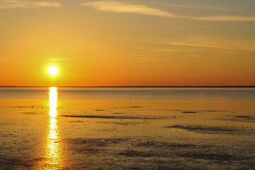 The evening sun in the Wadden Sea, over the island of Langeoog