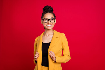 Photo of pretty business lady look empty space touch cardigan wear eyewear isolated on vivid red...