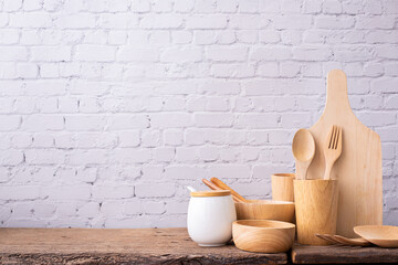 wooden kitchenware on kitchen table.