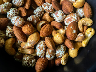 Dried fruits and Turkish delight with nuts mix on a black table background. And also its a very healty food