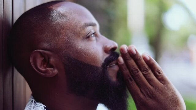 Spiritual black African person praying. Prayer feeling presence of God