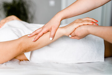 Obraz na płótnie Canvas Women's hands and fingers 4-hand massage in a modern beauty salon. The concept of health care and self-care