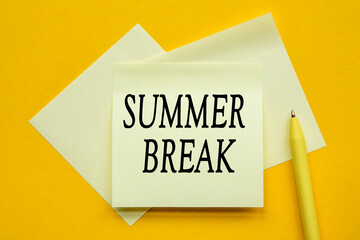 paper on yellow background with text SUMMER BREAK.